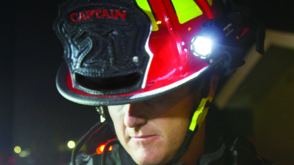 FIREFIGHTER CAPTAIN WEARING FOXFURY SIDESLIDE C-CLAM SIDE MOUNTED HELMET LIGHT ON HELMET BRIM
